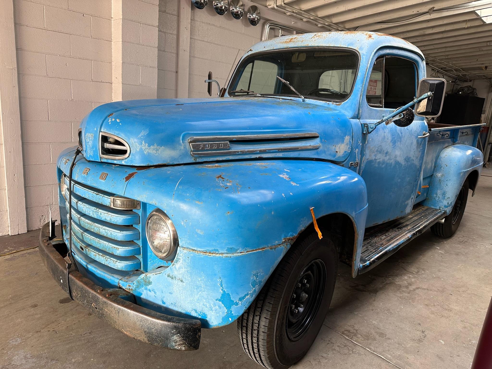 Ford classic car before restoration - showing wear and damage